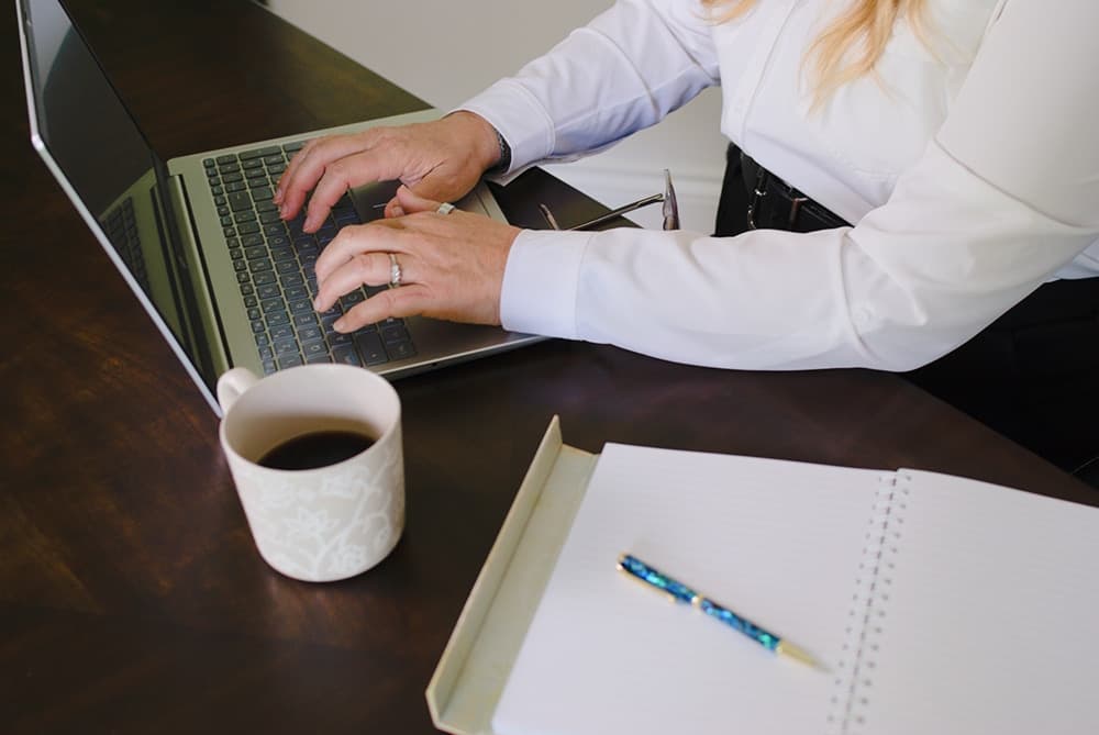 An arial photo of someone working at a desk.